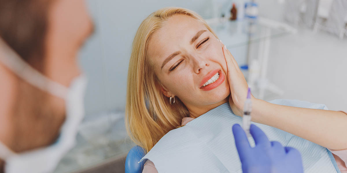 Причины возникновения зубной боли после лечения