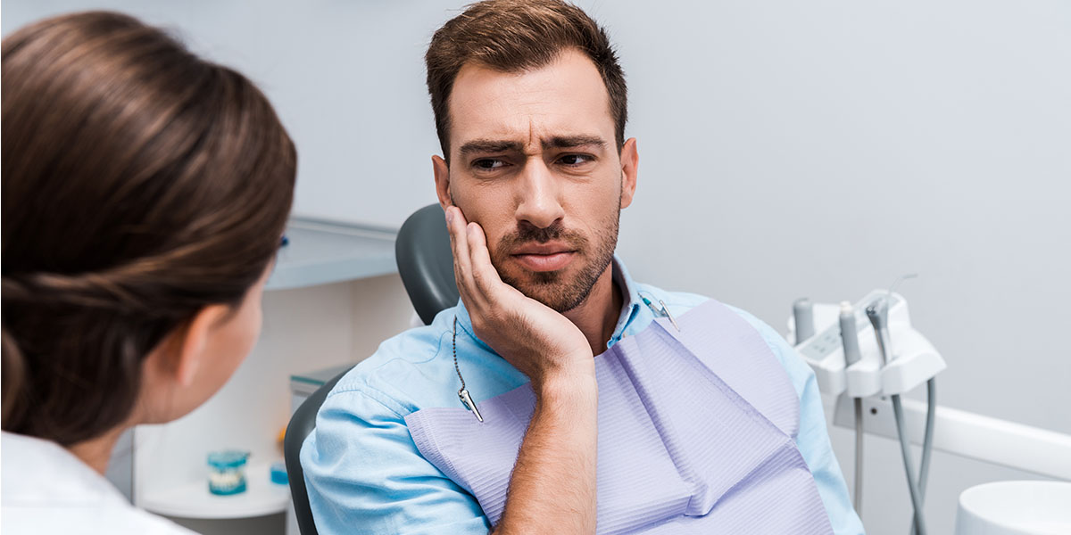 Болит зуб под пломбой: что делать?